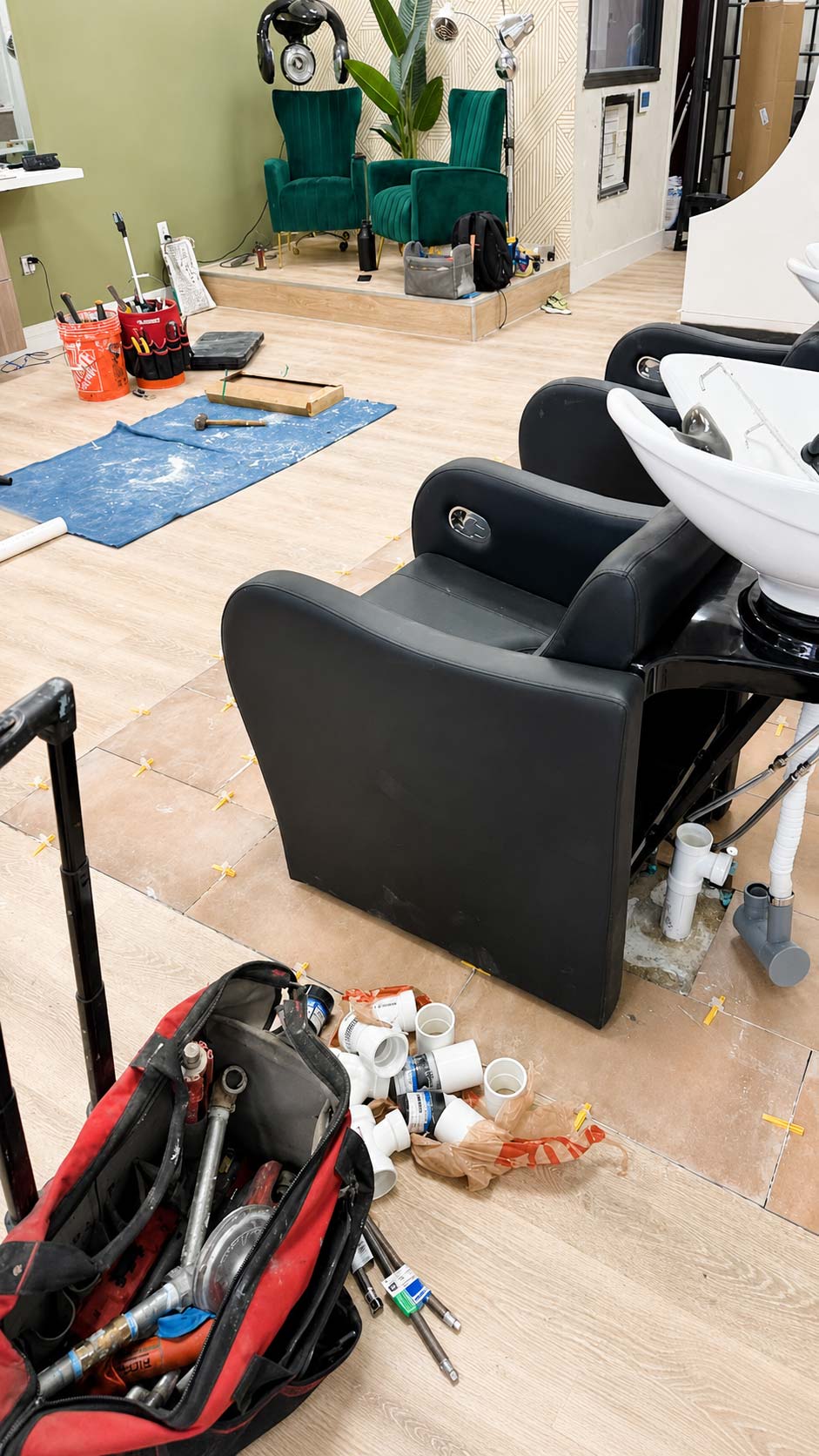 Commercial water and drain connections installed for a hair salon shampoo station