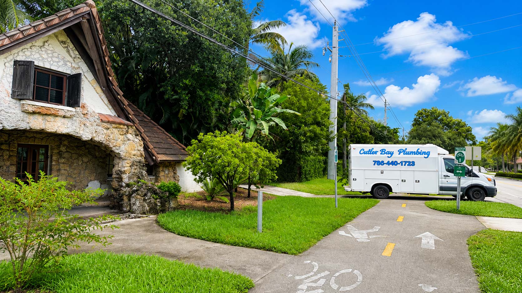 Plumbing service vehicle stationed at a second Pinecrest job location